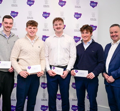 Photo of 2nd Place Fantasy Budget team from DCU in front of the Irish Tax Institute logo