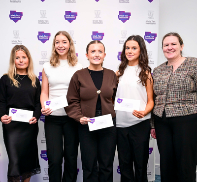Photo of 3rd Place Fantasy Budget team from University of Galway in front of the Irish Tax Institute logo